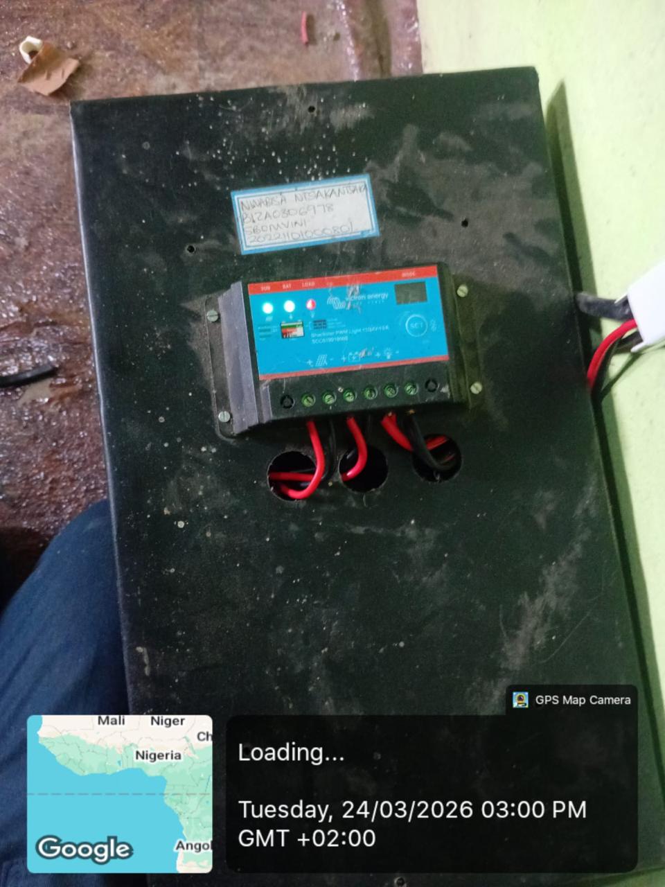 Electrical power control box with internal wiring visible.